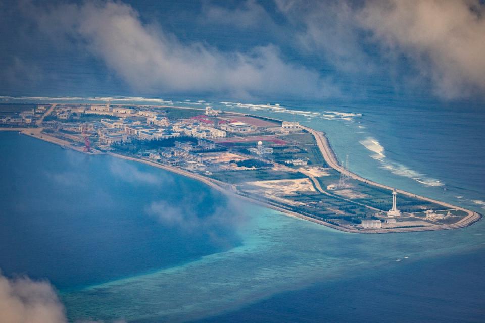 Buildings and structures are seen on the artificial island built by China in Subi Reef on 25 October 2022 in Spratly Islands, South China Sea. China has progressively asserted its claim of ownership over disputed islands in the South China Sea by artificially increasing the size of islands, creating new islands and building ports, military outposts and airstrips. The South China sea is an important trade route and is of significant interest as geopolitical tensions remain high in the region (Getty Images)