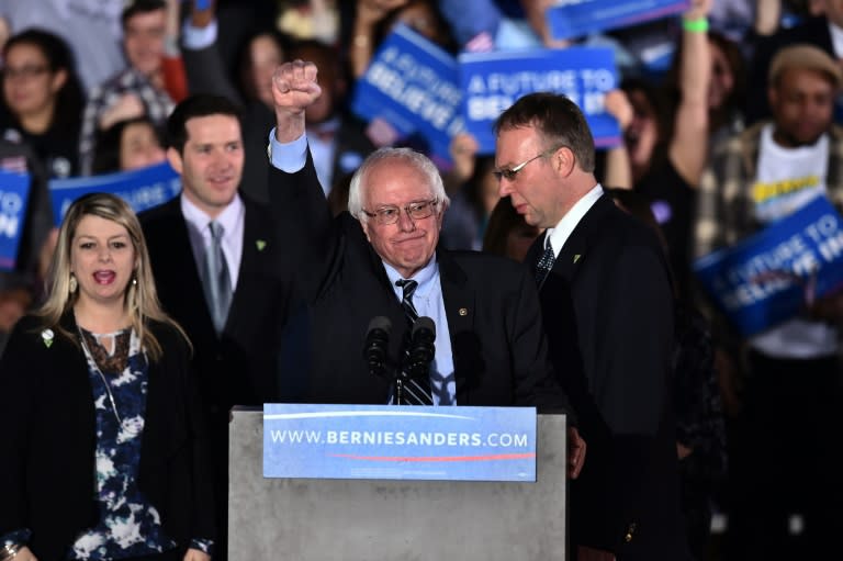 US Democratic presidential candidate Bernie Sanders celebrates victory during a primary night rally in Concord, New Hampshire, on February 9, 2016