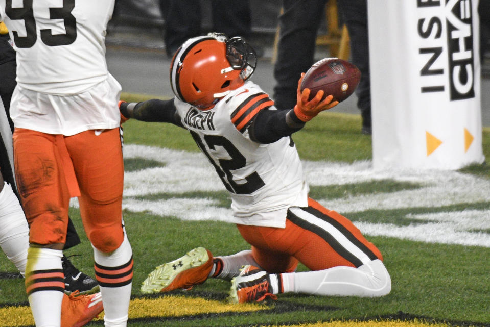 Cleveland Browns strong safety Karl Joseph (42) celebrates after recovering a fumbled in the end zone for a touchdown during the first half of an NFL wild-card playoff football game against the Pittsburgh Steelers in Pittsburgh, Sunday, Jan. 10, 2021.(AP Photo/Don Wright)