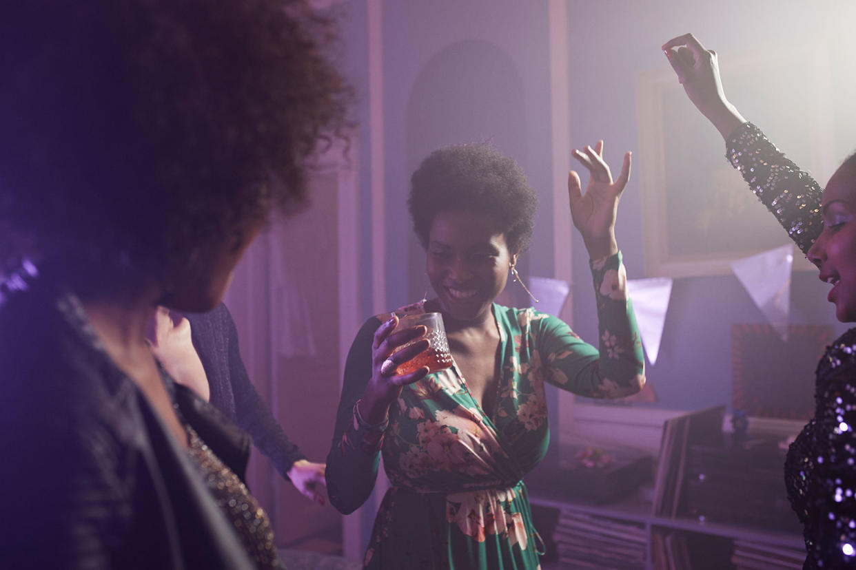 Young women having a party in an apartment Getty Images/Klaus Vedfelt