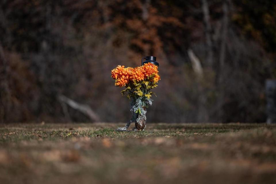 The gravesite of Derrick Johnson, who died from gun violence in 2020 at the age of 19, at Cedar Hill Memorial Park in Arlington on Sunday, Dec. 10, 2023.