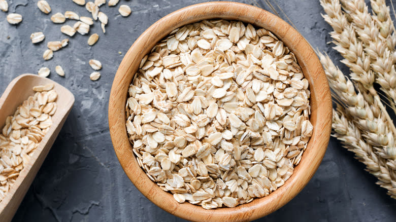 Rolled oats in wooden bowl