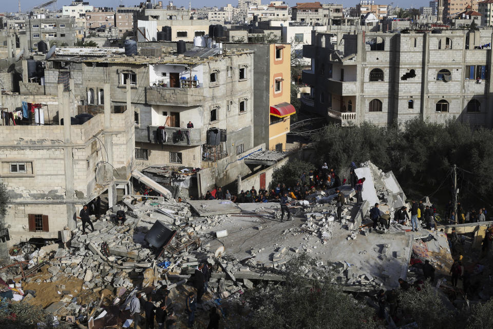 Palestinians look at the destruction after an Israeli strike on a residential building in Rafah, Gaza Strip, Sunday, March 3, 2024. (AP Photo/Hatem Ali)