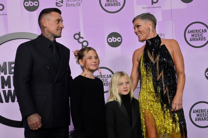 Pink (R) arrives with her husband, truck racer Carey Hart (L), and their children Willow and Jameson at the American Music Awards in Los Angeles in November. File Photo by Jim Ruymen/UPI