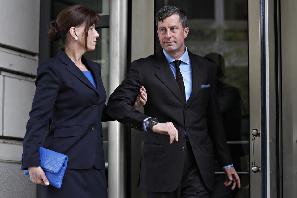 W. Samuel Patten, right, with his wife, leaves federal court after being sentenced to three years probation in the Trump Russia Probe case, Friday April 12, 2019, in Washington. (AP Photo/Jacquelyn Martin)