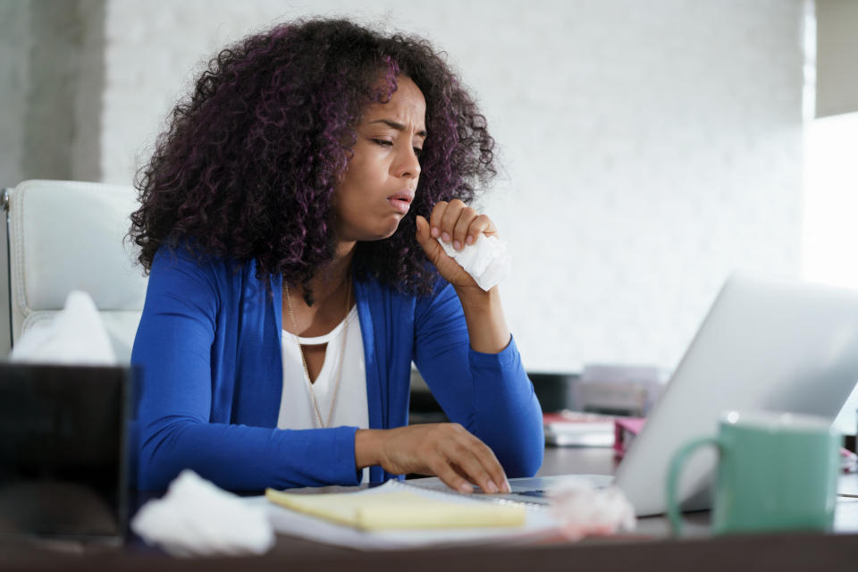 Coughing or sneezing near others is one of the top worker gripes. (Getty Images)