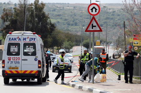 Israeli forensic police inspect the scene of Palestinian shooting attack near the Jewish settlement of Ariel, in the occupied West Bank March 17, 2019. REUTERS/Ammar Awad