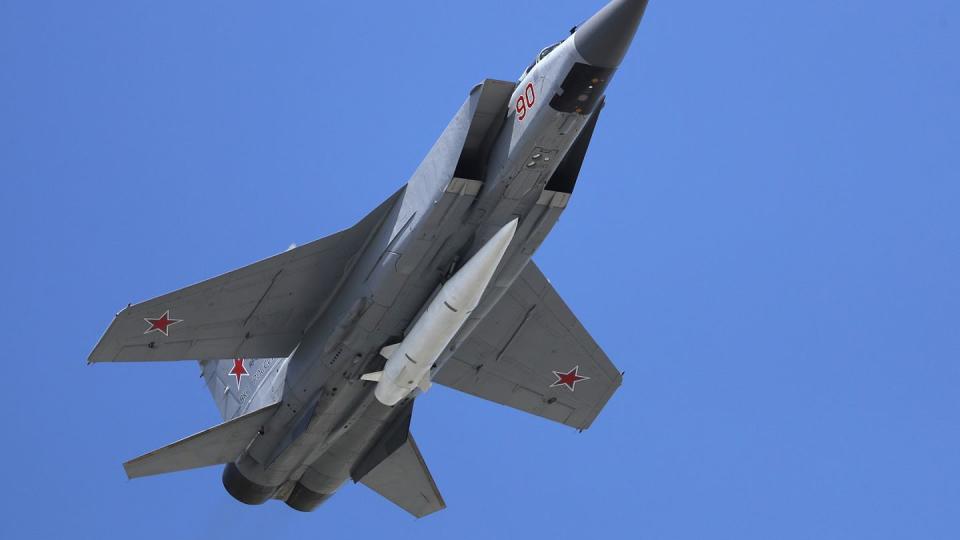 A Russian Air Force MiG-31K jet carries the hypersonic missile Kh-47M2 Kinzhal during a military parade. (Pavel Golovkin/AP)