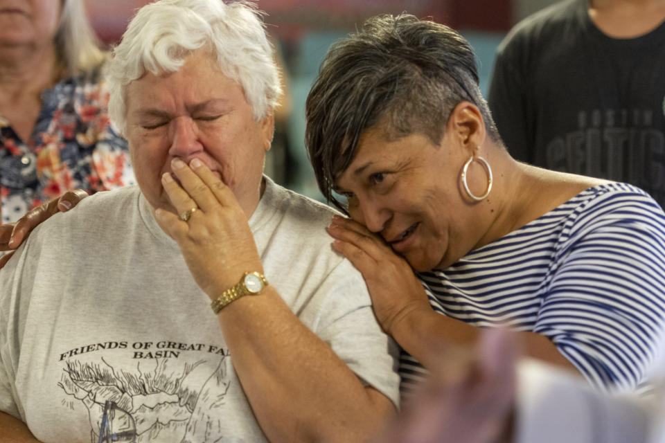 Leslie Irving embraces a Trona, Calif. resident at the Christian Fellowship of Trona, Calif., on Tuesday July 9, 2019. Irving was part of several High Desert charities to bring supplies to the town recovering after a pair of strong earthquakes hit last Thursday and Friday. It could be several more days before water service is restored to the tiny town of Trona, where officials trucked in portable toilets and showers. (James Quigg/The Daily Press via AP)