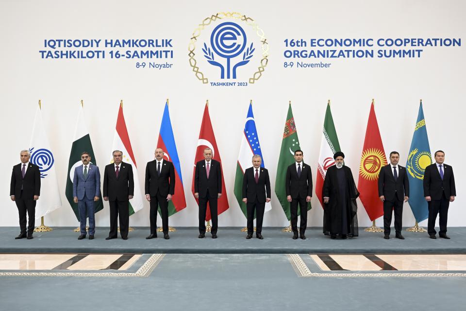 In this photo released by Uzbekistan's President Press Office, from left: Secretary General of the Economic Cooperation Organization (ECO) Khusrav Noziri , Pakistan's interim Prime Minister Anwaar-ul-Haq Kakar, Tajikistan's President Emomali Rahmon, Azerbaijan's President Ilham Aliyev, Turkey's President Recep Tayyip Erdogan, Uzbekistan's President Shavkat Mirziyoyev, Turkmenistan's President Serdar Berdymukhamedov, Iran's President Ebrahim Raisi, Kyrgyzstan's President Sadyr Japarov, and Kazakhstan Prime Minister Alikhan Smailov pose for a photo on the sidelines of the Summit of the Economic Cooperation Organisation (ECO) in Tashkent, Uzbekistan, on Thursday, Nov. 9, 2023. (Uzbekistan's President Press Office via AP)