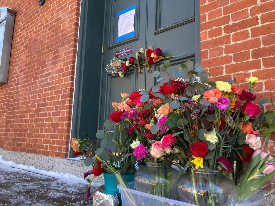 Flowers were placed outside the Temple Israel on Friday, Feb. 24, 2023, three days after the place of worship was targeted with hateful, anti-Semitic graffiti. On Friday, Portsmouth Assistant Mayor Joanna Kelley and local organizers held an event called "Love Blooms Here" at Kelley's business, Cup of Joe Cafe & Bar, in response to the barrage of vandalism that occurred earlier in the week. Cup of Joe was one of 15 locations in and around downtown Portsmouth hit with hateful graffiti, with many having swastikas spray painted on their buildings.