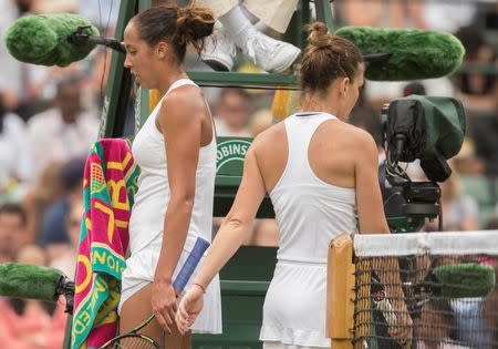 Madison Keys (USA) and Simona Halep (ROU) pass each other on a change of ends on day eight of the 2016 The Championships Wimbledon. Susan Mullane-USA TODAY Sports