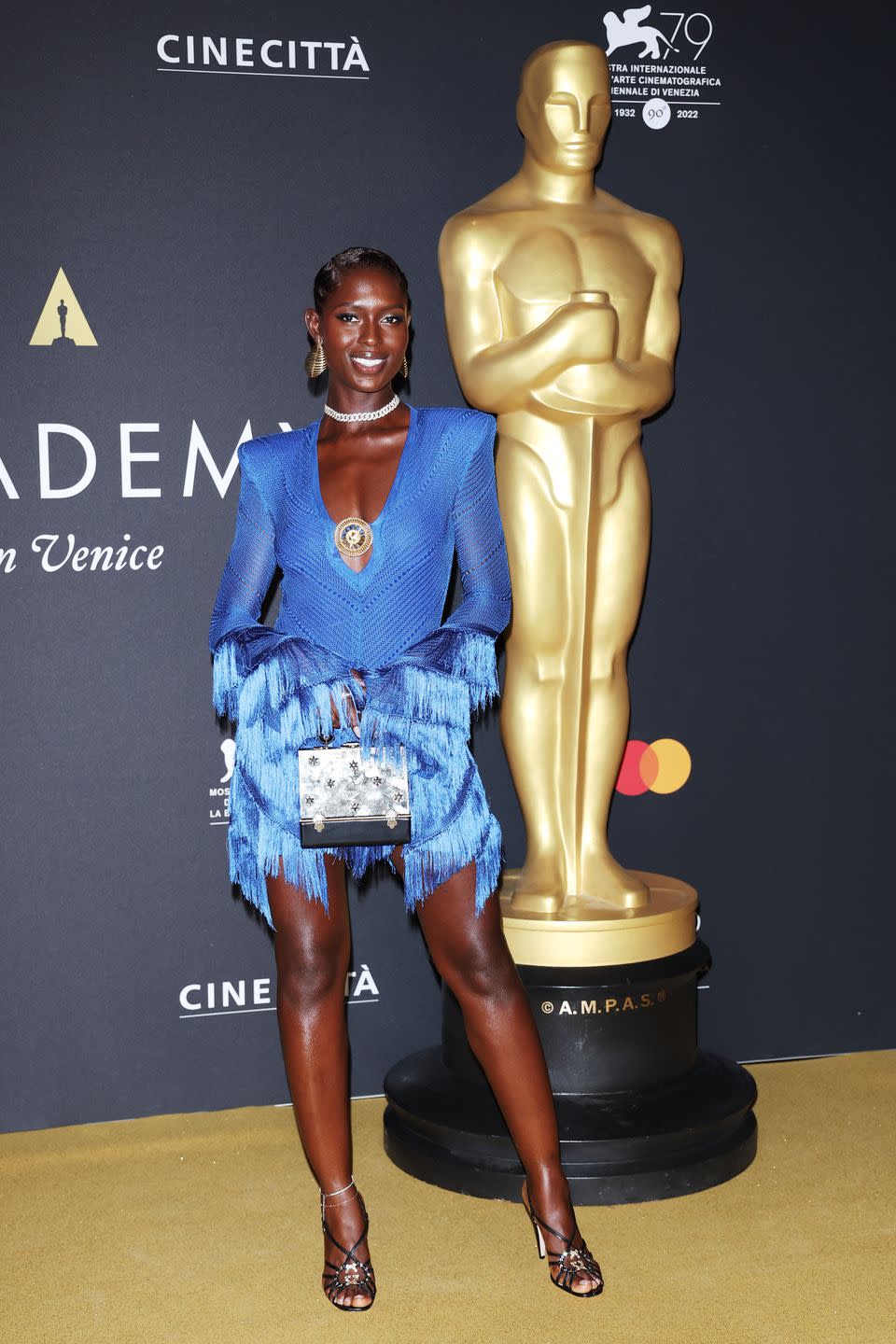 <p>The actor made an entrance to the pre-Venice Film Festival dinner event in a striking blue mini-dress by Raisa Vanessa and Fernando Jorge earrings.</p>