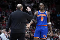 New York Knicks forward OG Anunoby, right, celebrates with coach Tom Thibodeau during the second half of the team's NBA basketball game against the Chicago Bulls in Chicago, Tuesday, April 9, 2024. (AP Photo/Nam Y. Huh)