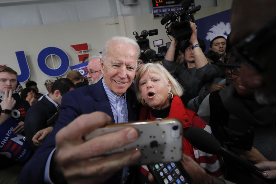 Democratic presidential candidate former Vice President Joe Biden takes photos with supporters after speaking at a campaign event in Sumter, S.C., Friday, Feb. 28, 2020. (AP Photo/Gerald Herbert)