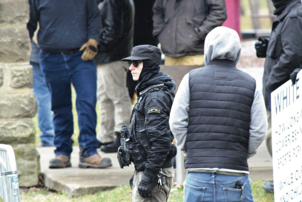 Aimenn Penny, 20, of Alliance, center looking left, was identified as participating March 11 in a protest in Wadsworth. Penny now faces federal charges that he particpated in firebombing a Geauga County church on March 25, ahead of a drag show event.