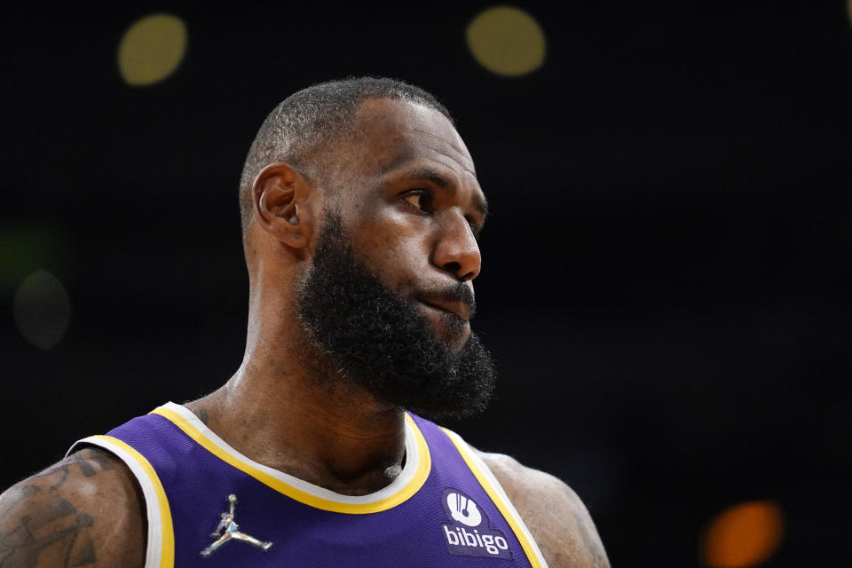 Los Angeles Lakers forward LeBron James stands on the court during the second half of an NBA basketball game against the Utah Jazz Wednesday, Feb. 16, 2022, in Los Angeles. (AP Photo/Mark J. Terrill)