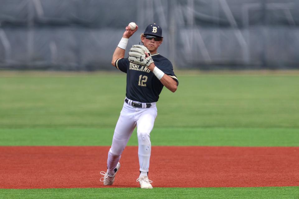 Bushland’s Kade Gavina (12) throws a runner out at first base in a 3A Regional Quarterfinal game against Idalou, May 20, 2023, at Amarillo High School in Amarillo, Texas.  Bushland won 5-3.