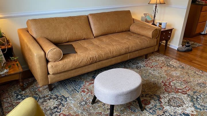 $400 off a Polly & Bark brown leather couch made with real Italian leather