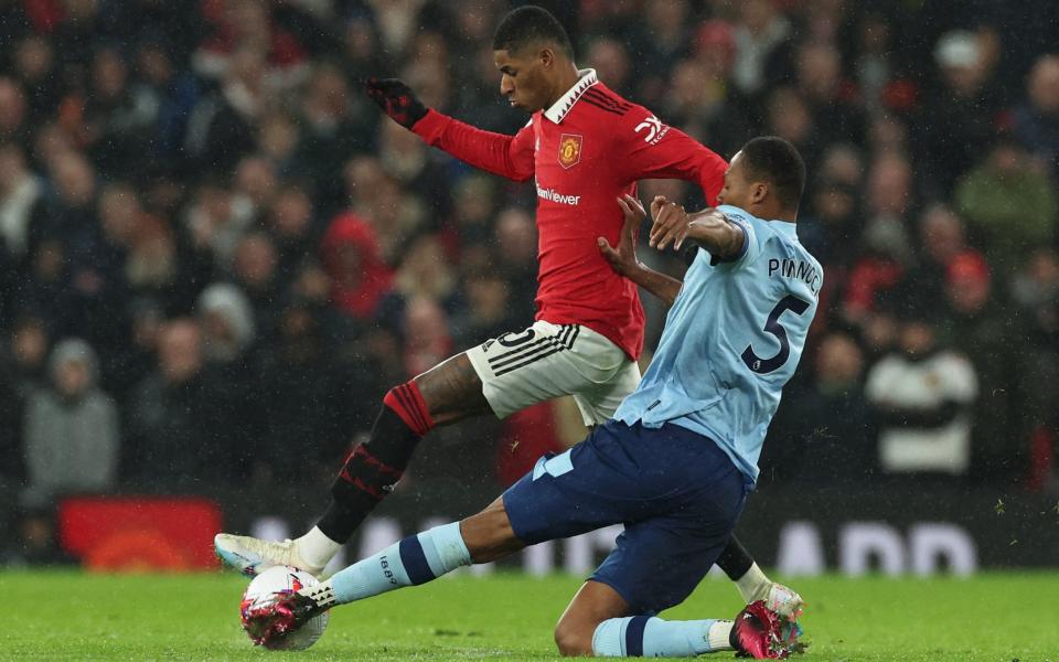 Manchester United's Marcus Rashford in action with Brentford's Ethan Pinnock