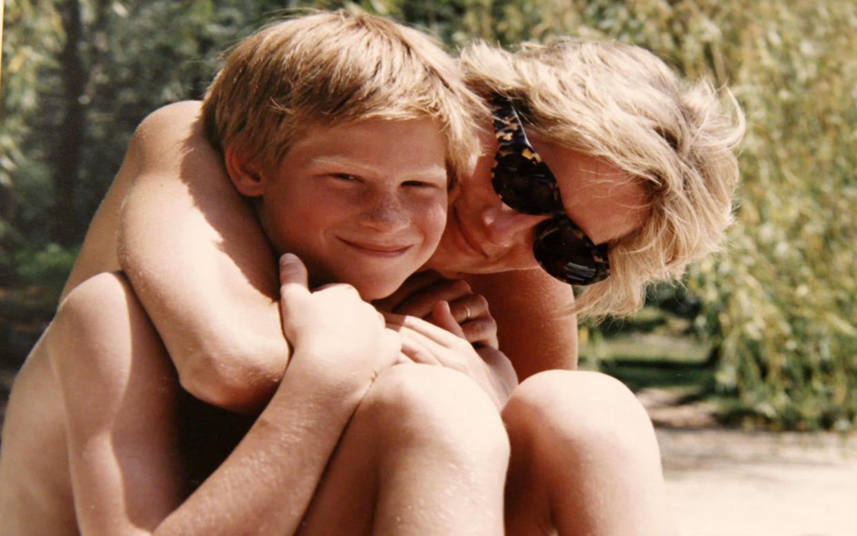 A newly-released photograph of Diana and Prince Harry, taken from from the personal photo album of the late Princess of Wales  - PA