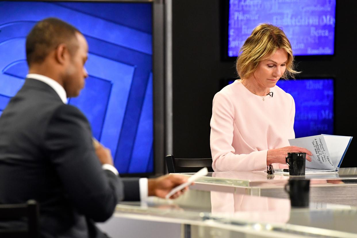 Kentucky gubernatorial candidate Kelly Craft, right, checks her notes before the start of the Kentucky Gubernatorial GOP Primary Debate in Lexington, Ky., Monday, May 1, 2023. At right is Kentucky Attorney General Daniel Cameron.