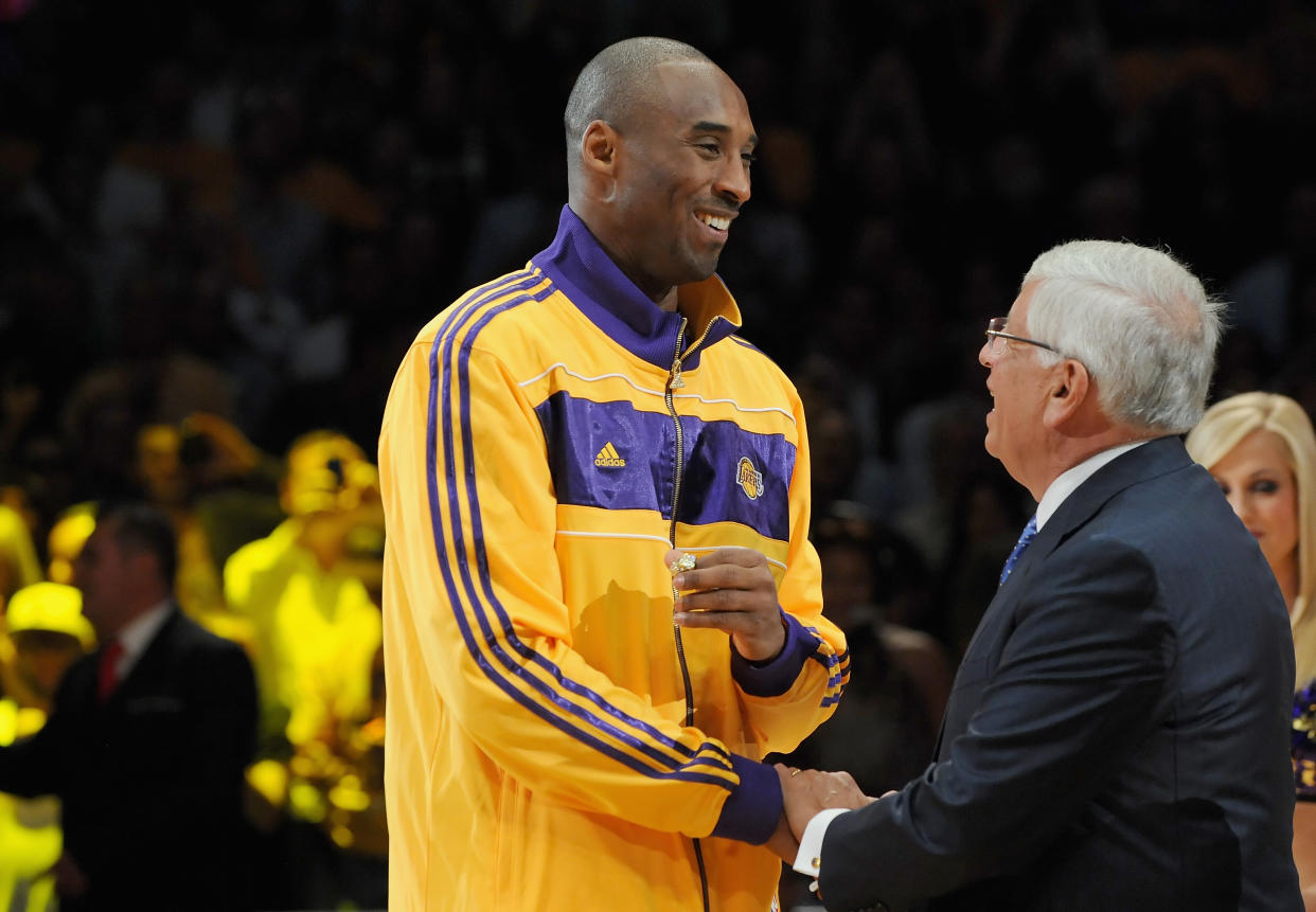 Kobe Bryant #24 of the Los Angeles Lakers receives his championship ring from NBA commissioner David Stern.