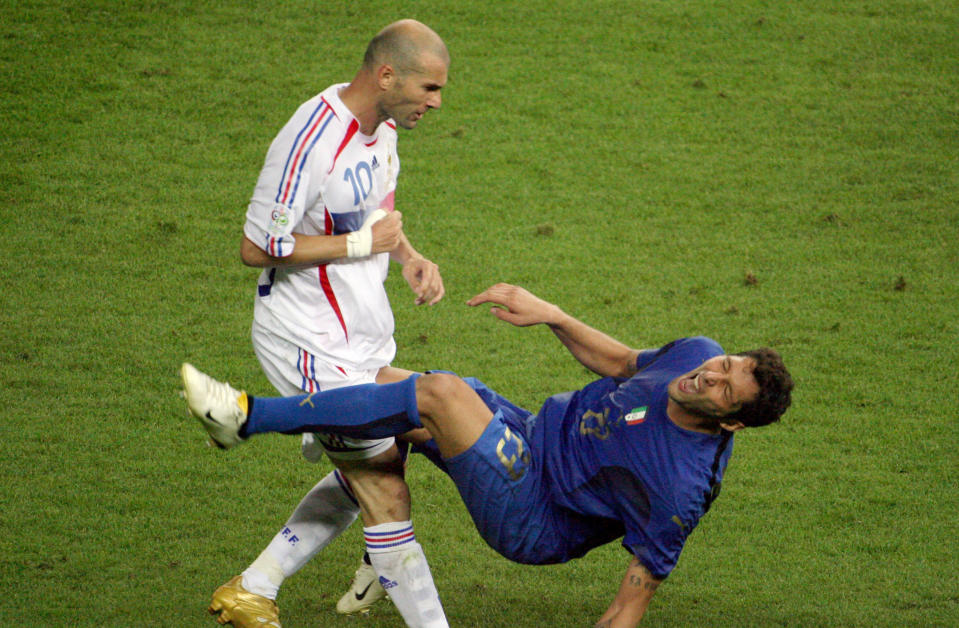 A photo taken 09 July 2006 shows French midfielder Zinedine Zidane (L) gesturing after head-butting Italian defender Marco Materazzi during the World Cup 2006 final football match between Italy and France at Berlins Olympic Stadium.  AFP PHOTO  JOHN MACDOUGALL / AFP / JOHN MACDOUGALL        (Photo credit should read JOHN MACDOUGALL/AFP/Getty Images)