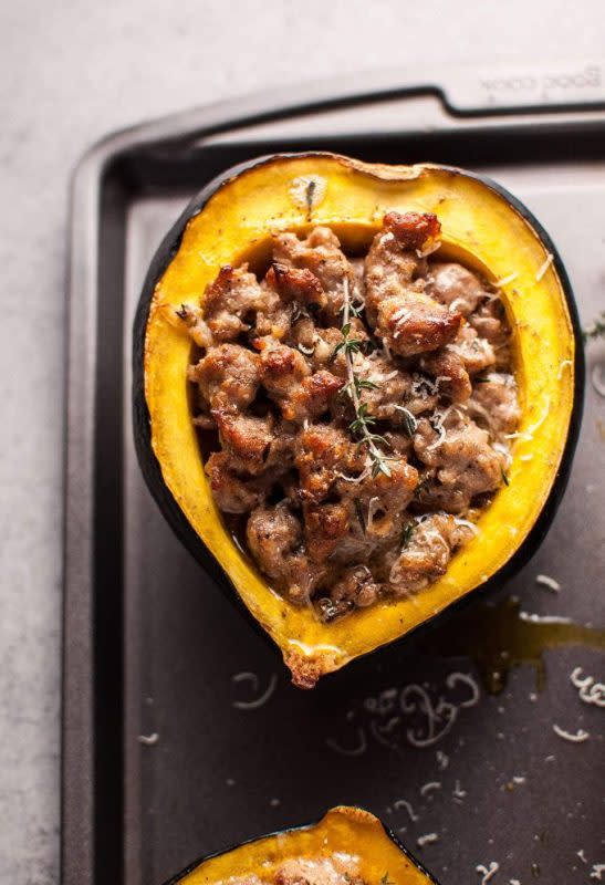 <p>Salt and Lavender</p><p>This sausage stuffed acorn squash recipe makes a cozy and delicious cold weather meal! It’s loaded with parmesan cheese, butter, and fresh thyme. It will be terribly hard not to love the fall flavors this dish imbues. </p><p><strong>Get the recipe: <a href="https://www.saltandlavender.com/sausage-parmesan-stuffed-acorn-squash/" rel="nofollow noopener" target="_blank" data-ylk="slk:Sausage & Parmesan Stuffed Acorn Squash;elm:context_link;itc:0;sec:content-canvas" class="link ">Sausage & Parmesan Stuffed Acorn Squash</a></strong></p>