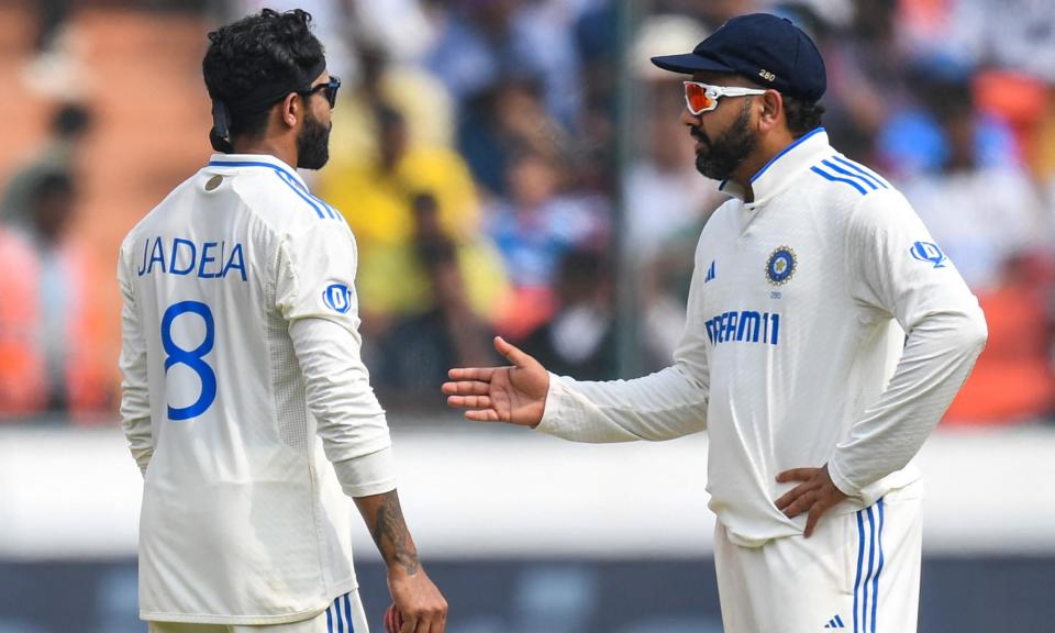 <span>India's captain, Rohit Sharma (right), came under pressure in the first Test as England’s batters took on his spinners.</span><span>Photograph: Noah Seelam/AFP/Getty Images</span>