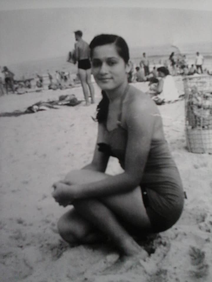 Carmen Torres, John's mother, at the beach during the 1950s.