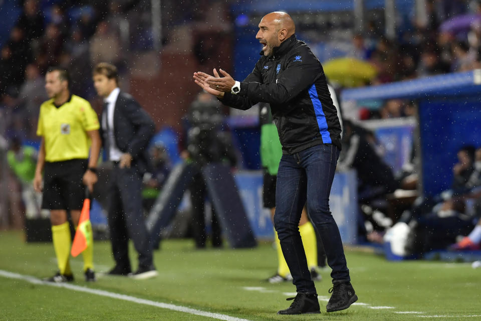 FILE - In this Saturday, Oct. 6, 2018 file photo, Deportivo Alaves' head manager Abelardo Fernandez, encourages his players during the Spanish La Liga soccer match between Real Madrid and Deportivo Alaves at Mendizorroza stadium, in Vitoria, northern Spain. The Spanish league only has four games remaining, but there are some coaches who may not make it that far. Real Betis manager Quique Setien and Girona’s Eusebio Sacristan are under pressure after losing streaks, while Alaves coach Abelardo Fernandez has had a falling out with his club over his future. (AP Photo/Alvaro Barrientos, File)