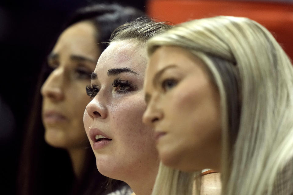 Texas guard Shaylee Gonzales, center, watches from the bench during an NCAA college basketball game against Kansas State in the the Big 12 Conference tournament Friday, March 10, 2023, in Kansas City, Mo. (AP Photo/Charlie Riedel)