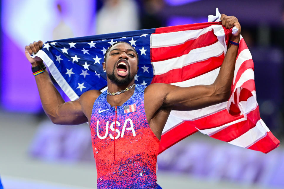 USA's Noah Lyles celebrates after winning the men's 100m final of the athletics event at the Paris 2024 Olympic Games at Stade de France in Saint-Denis, north of Paris, on August 4, 2024. (Photo by Mehmet Murat Onel/Anadolu via Getty Images)