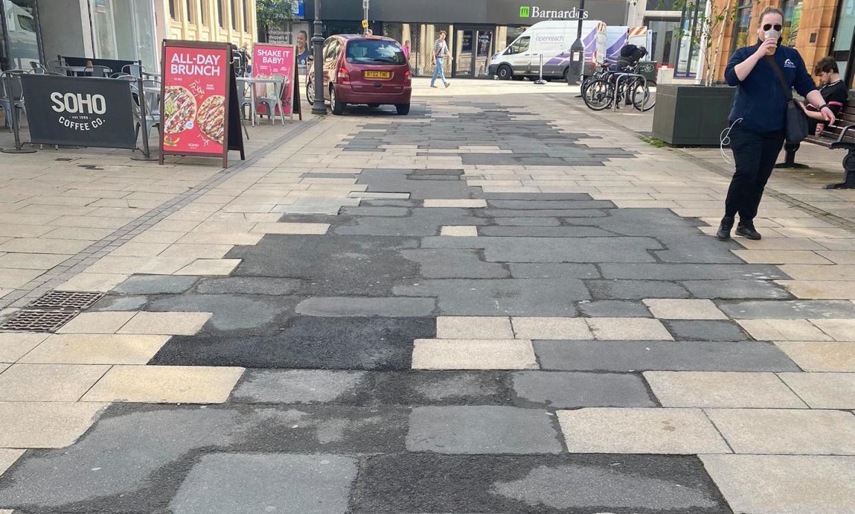 <span>Paving stones in Cheltenham filled in with concrete.</span><span>Photograph: Cheltenham Civic Society</span>