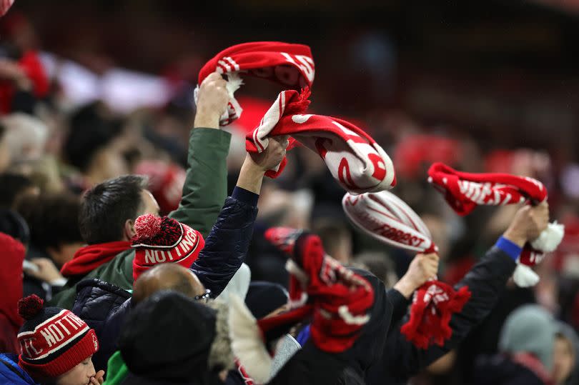 Nottingham Forest supporters celebrate during the Premier League match between Nottingham Forest and Fulham FC at City Ground on April 02, 2024 in Nottingham, England