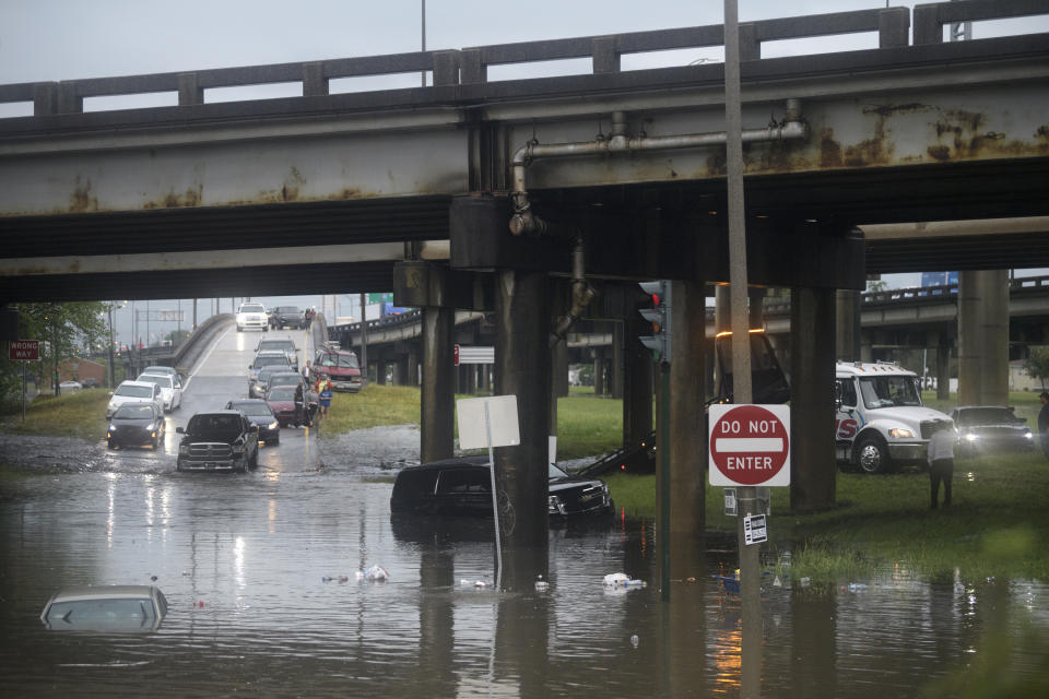 Motorist try to maneuver around flooding at the intersection of Franklin Ave. and 610 following heavy rain, Wednesday, July 10, 2019, in New Orleans. (Max Becherer/The Advocate via AP)