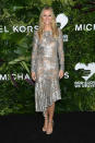 <p>Gwyneth Paltrow wore a suntan asymmetrical dress with silver leaf sequinned embroidery from the Spring 2018 Michael Kors Collection.</p>