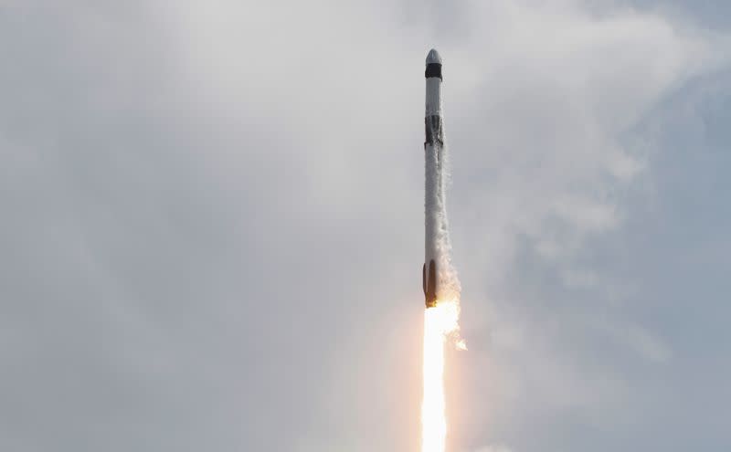 A SpaceX Falcon 9 rocket and Crew Dragon spacecraft carrying NASA astronauts Douglas Hurley and Robert Behnken lifts off