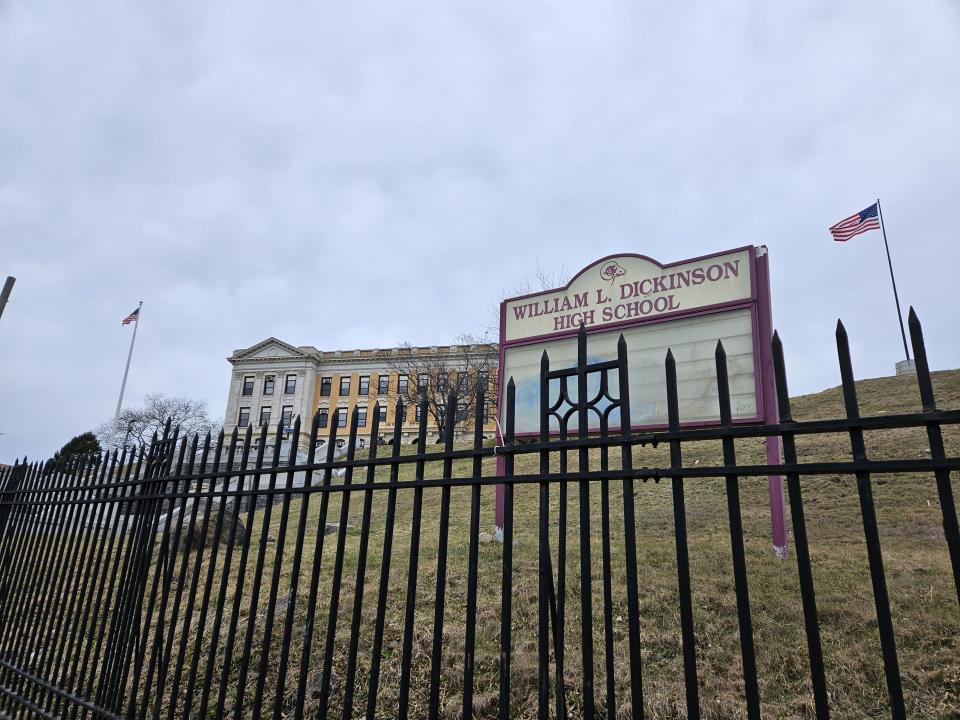 <p>Galaxy S23 Plus camera sample: A school on a slight hill with the American flag in the background and a sign in the foreground saying "William L. Dickinson High School."</p>
