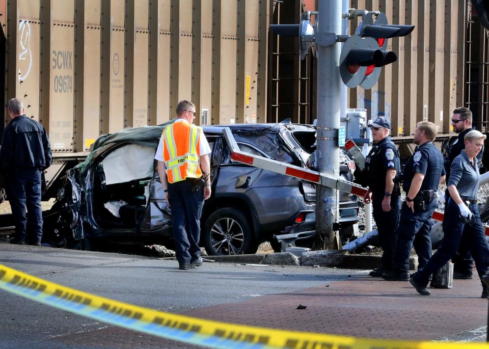 Emergency crews work a fatal accident involving a vehicle that was hit by a train at a railroad crossing near the Smyrna depot on Washington Street in downtown Smyrna Tenn. on Monday, Nov. 13, 2023.