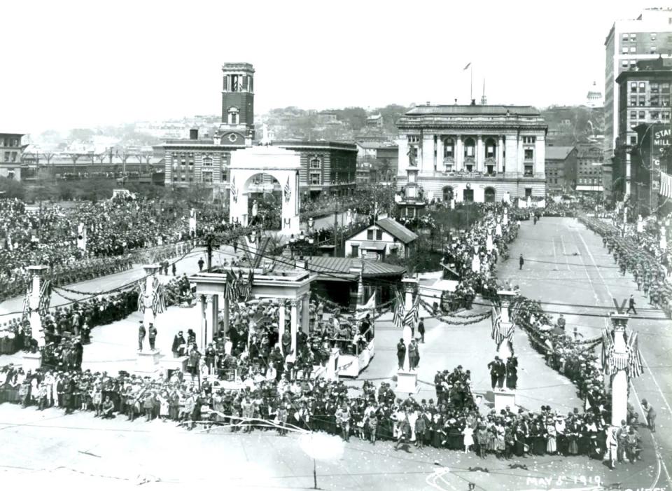 This May 5, 1919, photo shows the parade and celebration honoring veterans who served in World War I. It is likely that Exchange Place was decorated in a similar fashion for Memorial Day, minus the victory arch.