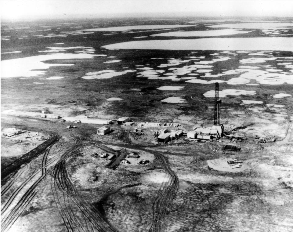 FILE - This 1968 aerial view shows Prudhoe Bay, on the Arctic slope 390 miles north of Alaska. BP, a major player on Alaska's North Slope for decades, is selling all of its assets in the state, the company announced Tuesday, Aug. 27, 2019. Hilcorp Alaska is purchasing BP interests in both the Prudhoe Bay oil field and the trans-Alaska pipeline for $5.6 billion, BP announced in a release. (AP Photo)