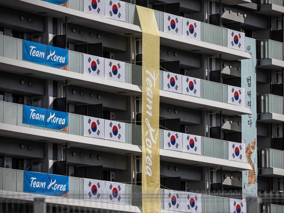 South Korean flags hang from the Tokyo Olympics athlete's village towers.