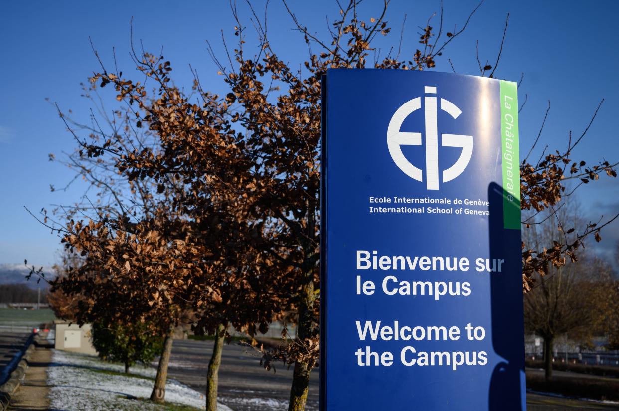 This photograph taken on December 3, 2021, shows a sign at the entrance of the Châtaigneraie campus of the International School of Geneva, closed after two cases of the Omicron variant were found, in Founex, Switzerland. - At least 2,000 peoples, including 1,600 children, have been in quarantine after two cases of the Omicron variant were found on one of the campuses of the International School of Geneva. 
