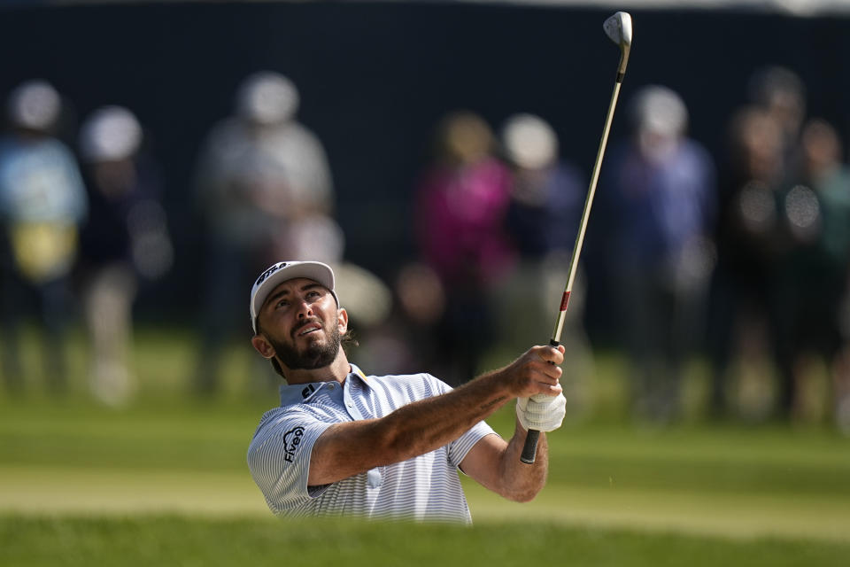 Max Homa hits from the rough on the fourth hole during the first round of the PGA Championship golf tournament at Oak Hill Country Club on Thursday, May 18, 2023, in Pittsford, N.Y. (AP Photo/Eric Gay)