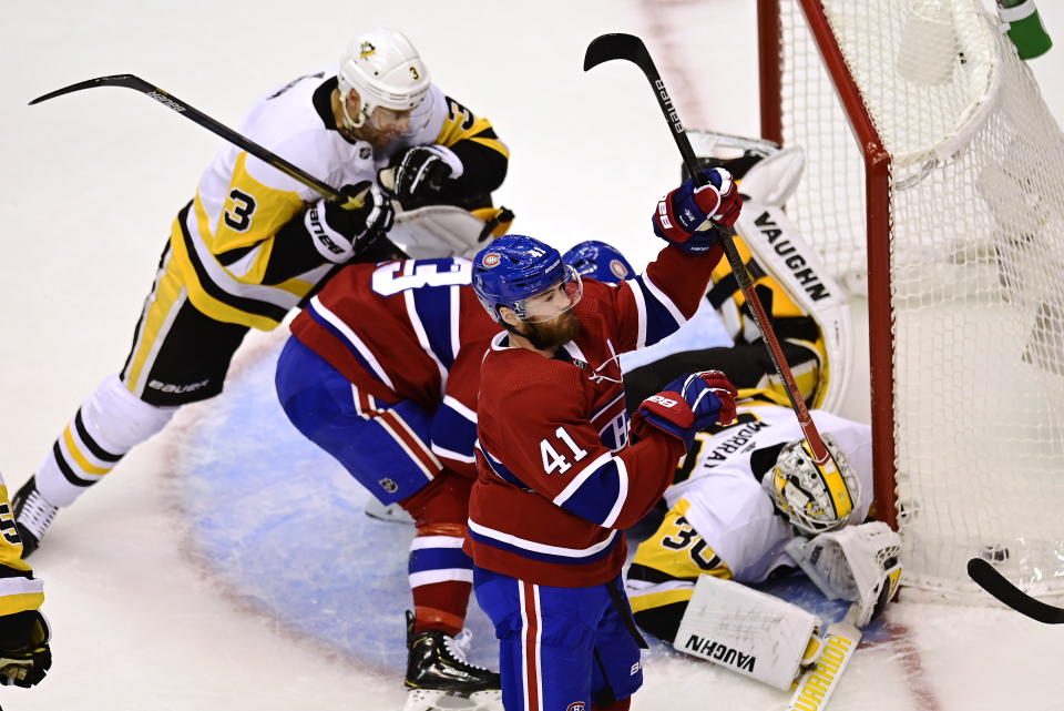 Montreal Canadiens' Paul Byron (41) celebrates his goal on Pittsburgh Penguins goaltender Matt Murray (30) during the second period of an NHL hockey playoff game Wednesday, Aug. 5, 2020 in Toronto. (Frank Gunn/The Canadian Press via AP)