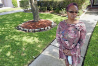 Parent and teacher Stacey Pugh poses for a photograph outside her home Monday, July 13, 2020, in Humble, Texas. While children have proven to be less susceptible to the coronavirus, teachers are vulnerable. “I will be wearing a mask, a face shield, possibly gloves, and I’m even considering getting some type of body covering to wear,” says Pugh, a fifth-grade teacher in suburban Houston. (AP Photo/David J. Phillip)