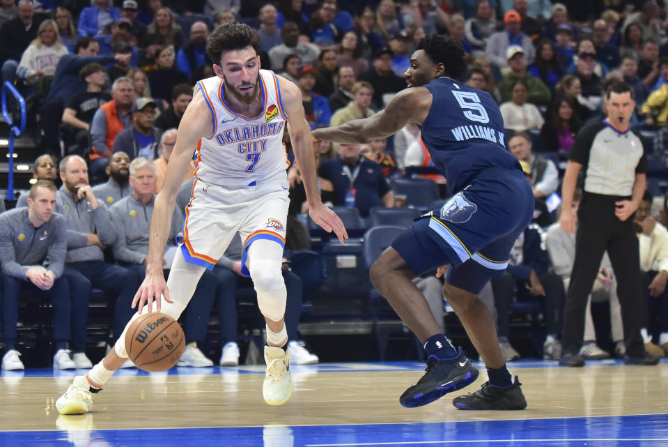 Oklahoma City Thunder forward Chet Holmgren (7) pushes past Memphis Grizzlies guard Vince Williams Jr. (5) in the first half of an NBA basketball game, Monday, Dec. 18, 2023, in Oklahoma City. (AP Photo/Kyle Phillips)