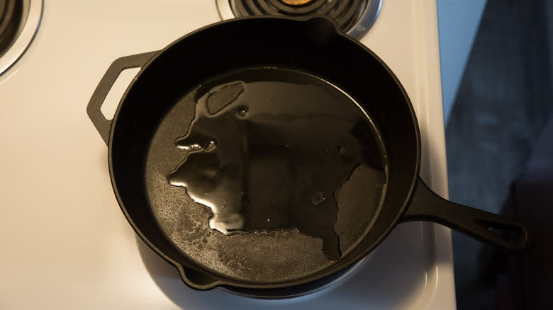 oil heating in stovetop pan 